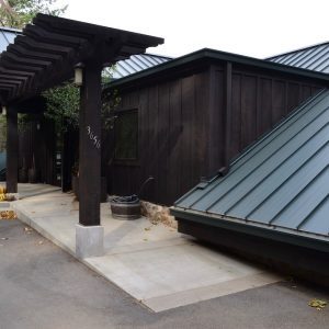 A concrete ramp and level walkway leading to the Keenan Winery buildings