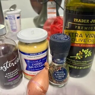 Crushed blueberry vinegar, Dijon mustard, olive oil, shallot and peppercorns for the vinaigrette