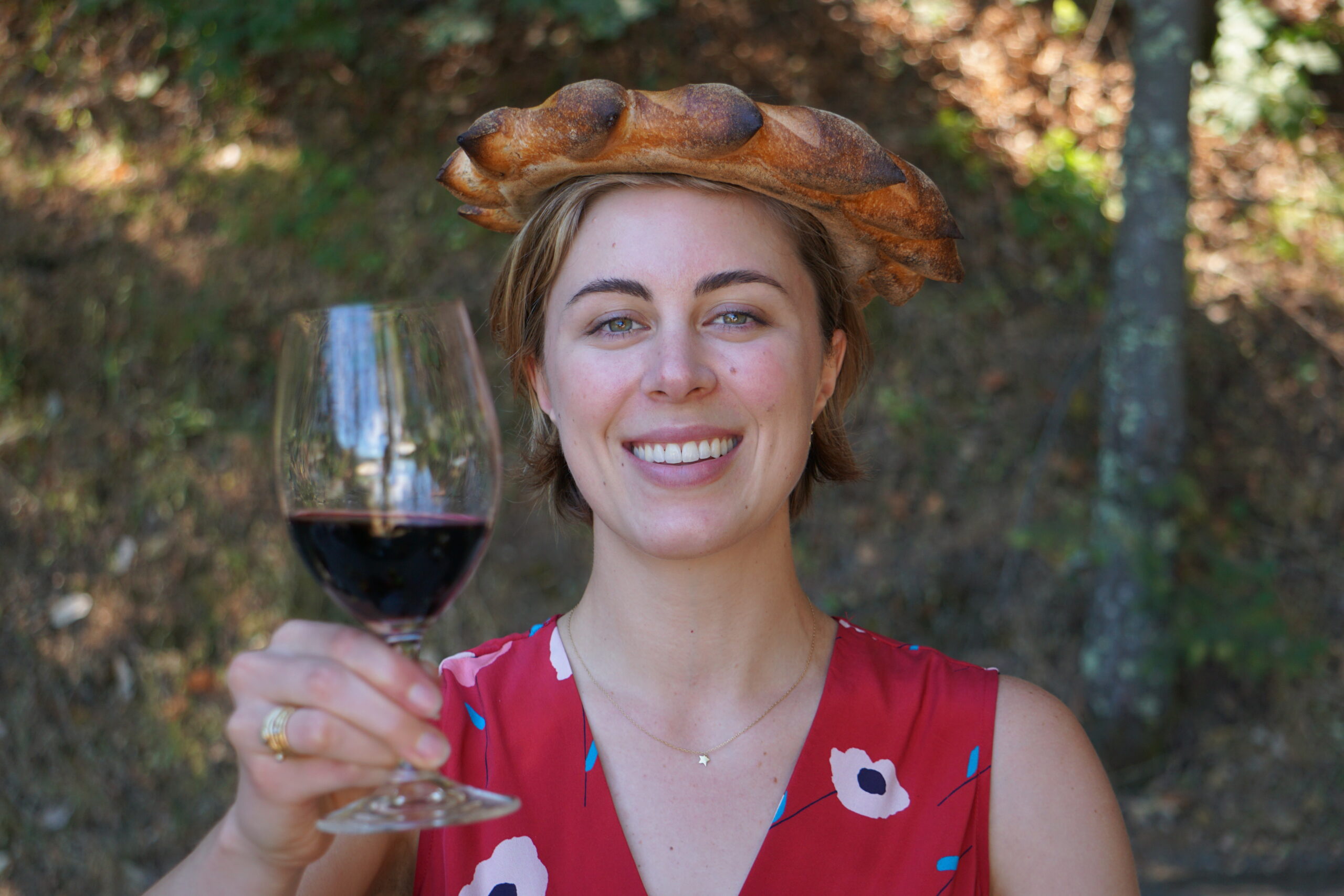 Maddy Keenan daughter of Michael and Jennifer Keenan holding a glass of wine